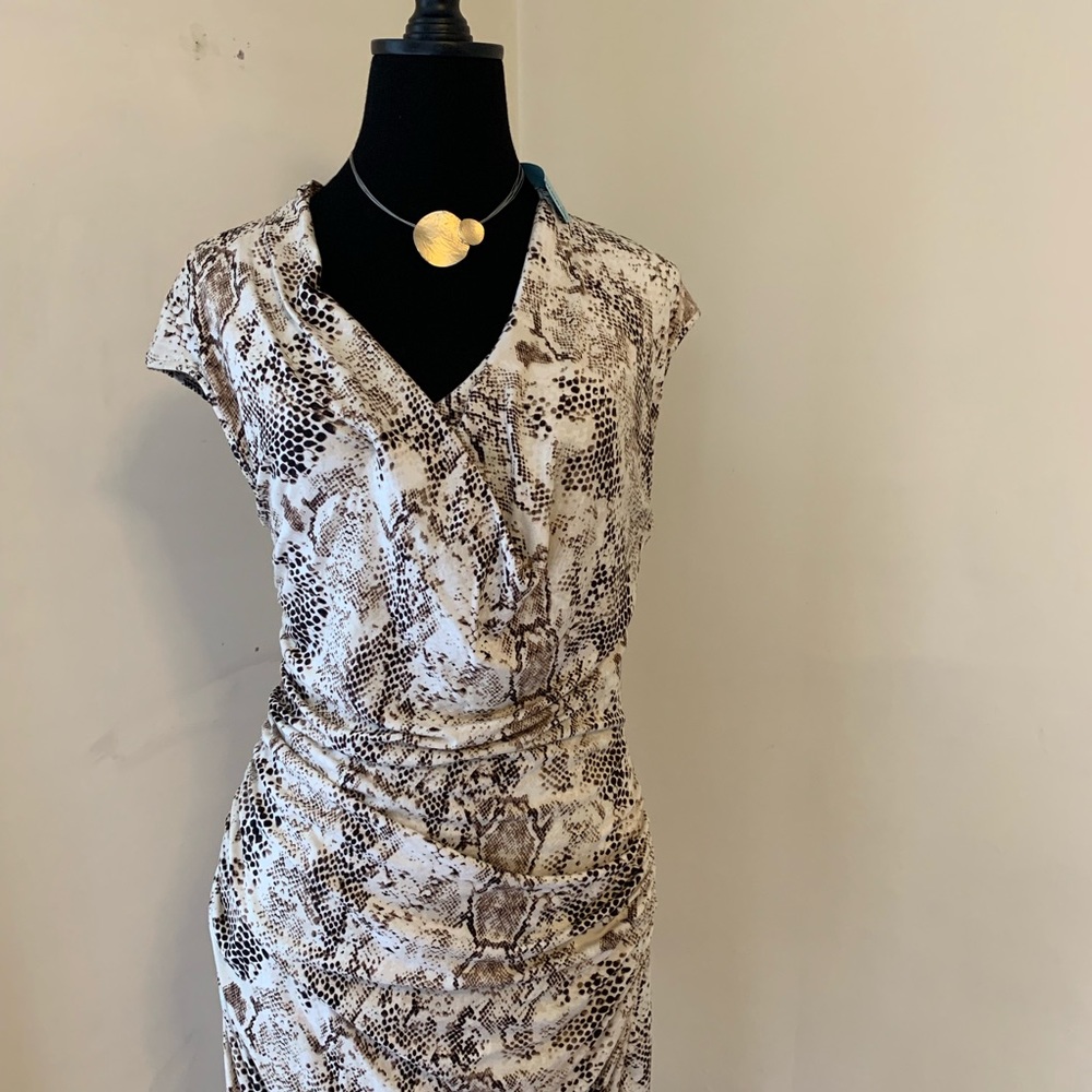 SOLD.    Beautiful ruched snakeskin design